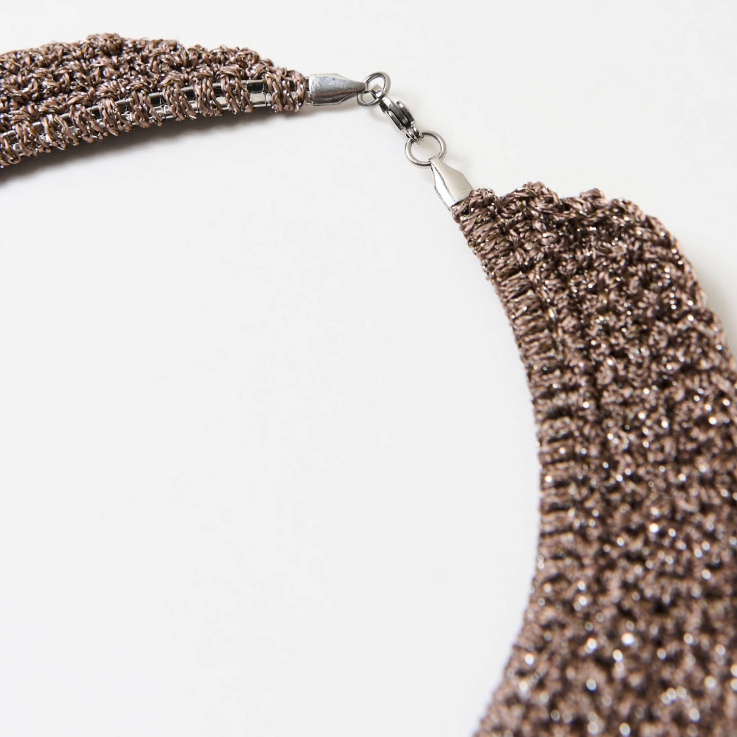 Detailed view of the lobster clasp and secure metal findings on the handmade copper necklace.