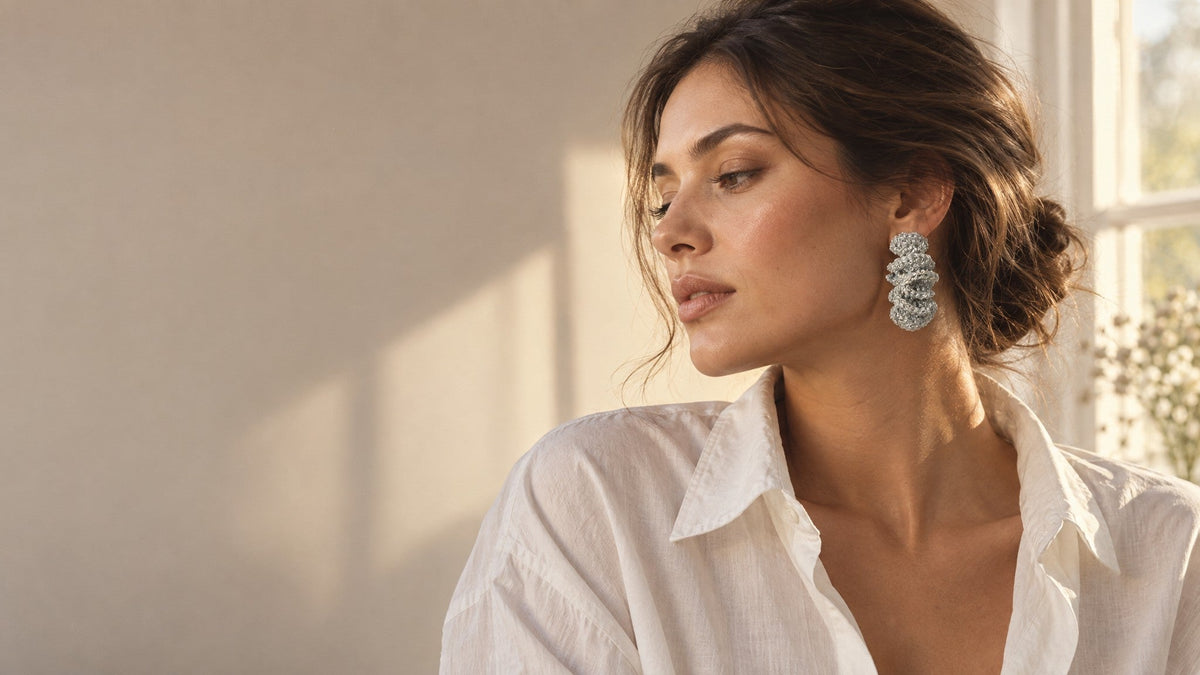 Woman wearing sculptural statement earrings, styled from day to night, LODORFO