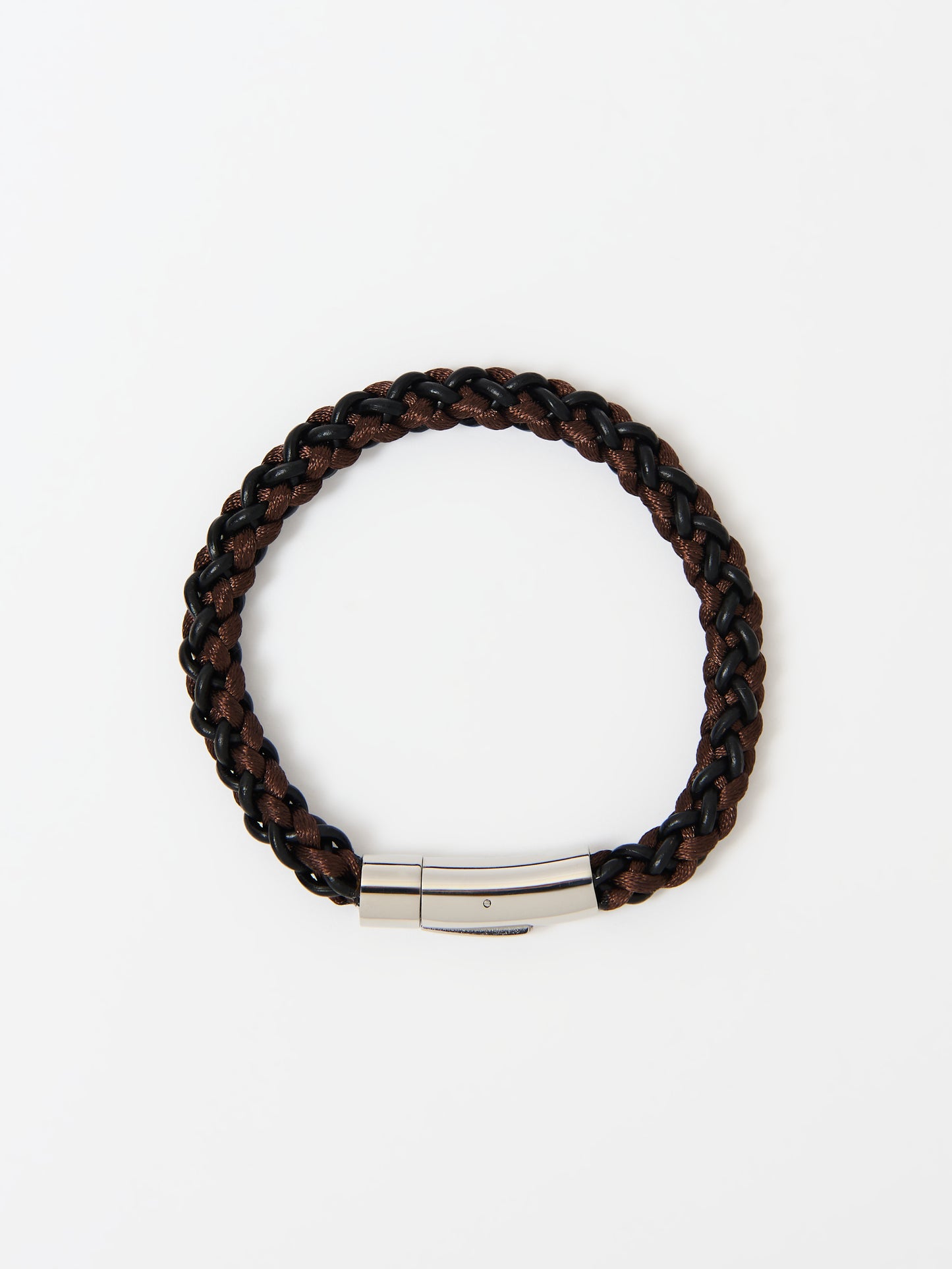 Close-up of a braided bracelet featuring intertwined brown and black materials with stainless steel magnetic clasp ends, displayed on a white background.