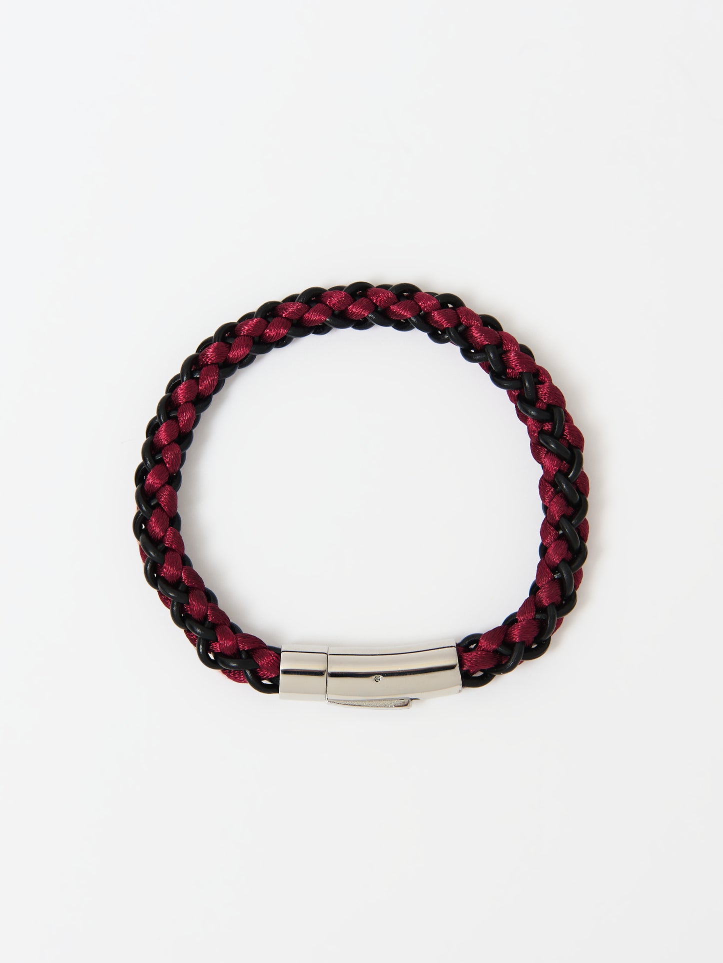 Close-up of a braided bracelet featuring intertwined red and black materials with gold magnetic clasp ends, displayed on a white background.