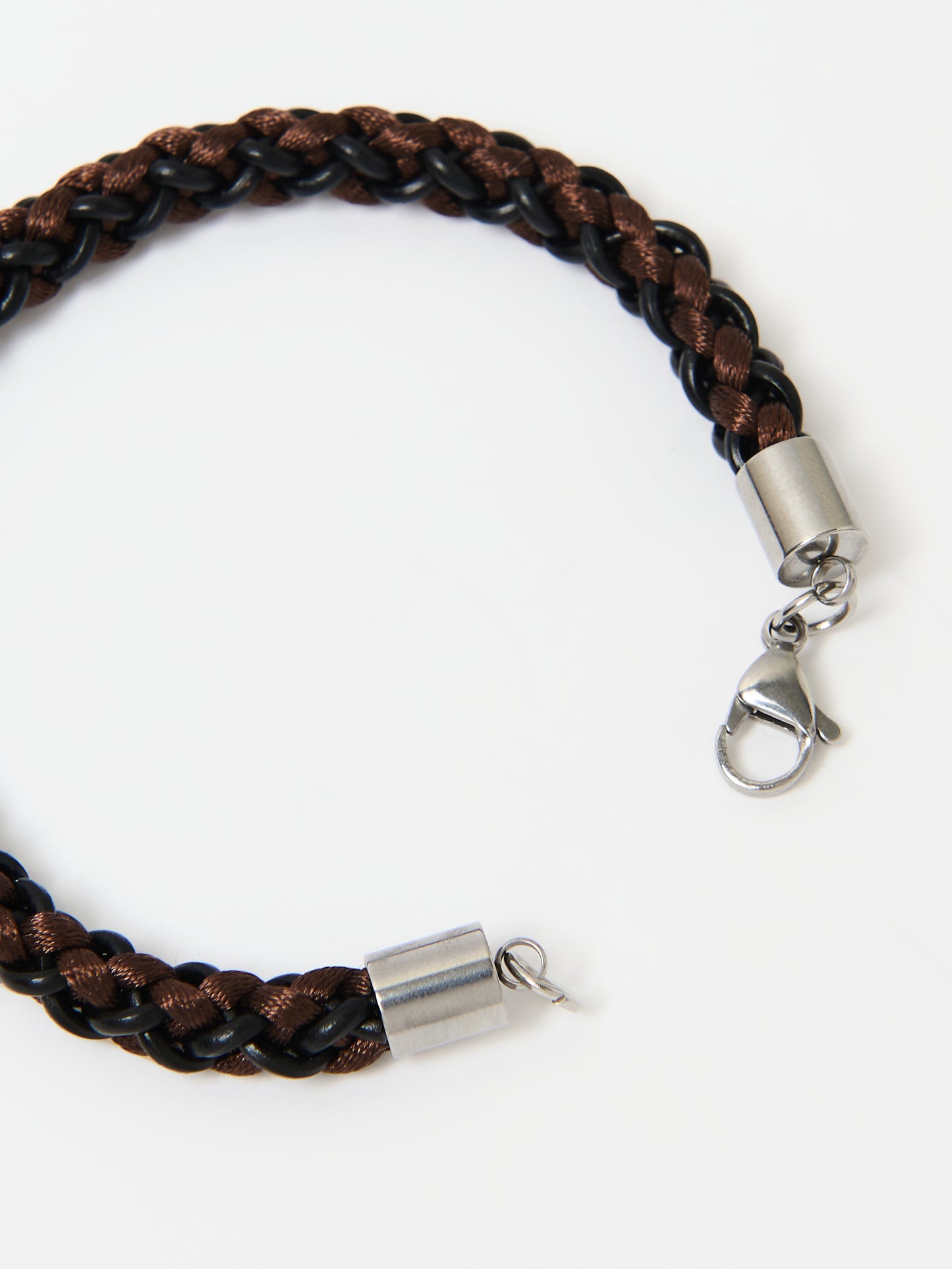 Close-up of a braided bracelet featuring intertwined brown and black materials with stainless steel lobster clasp ends, displayed on a white background.