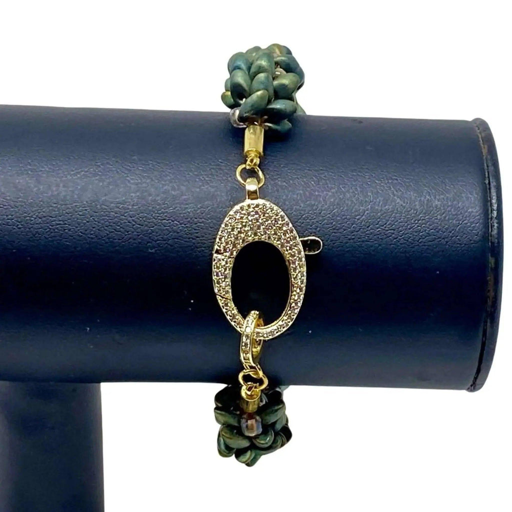 The Elio Beaded Bracelet shown on a display, focus on the clasp.