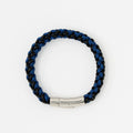 The Arden men's braided leather bracelet in Indigo Blue with a polished silver magnetic clasp, laid flat