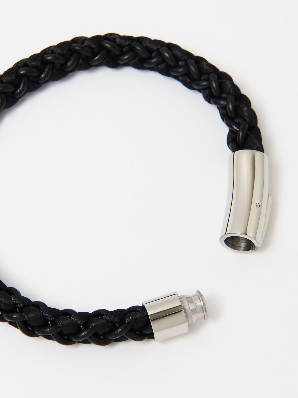 Full-frame close-up of the Arden Midnight Black braided leather bracelet and its polished silver magnetic clasp