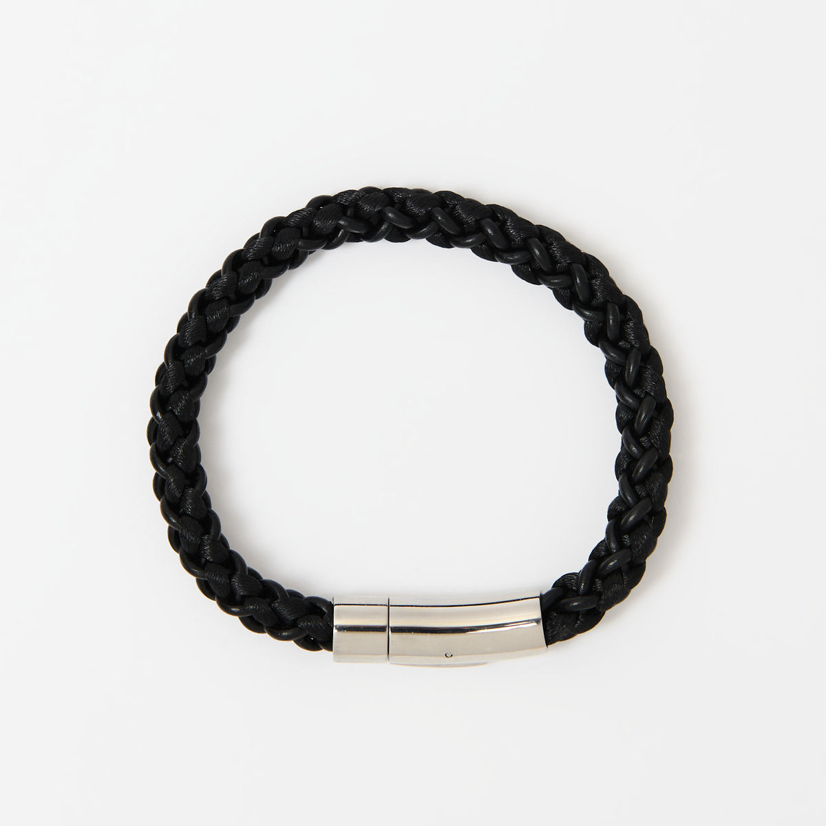 The Arden men's braided leather bracelet in Midnight Black with a polished silver magnetic clasp, laid flat