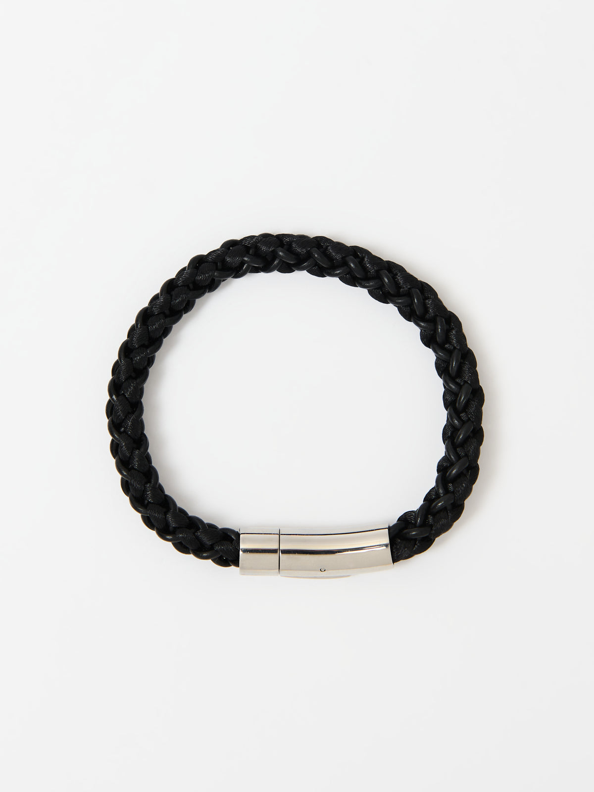 Full-frame view of the Arden Midnight Black braided leather bracelet with a polished silver magnetic clasp, laid flat