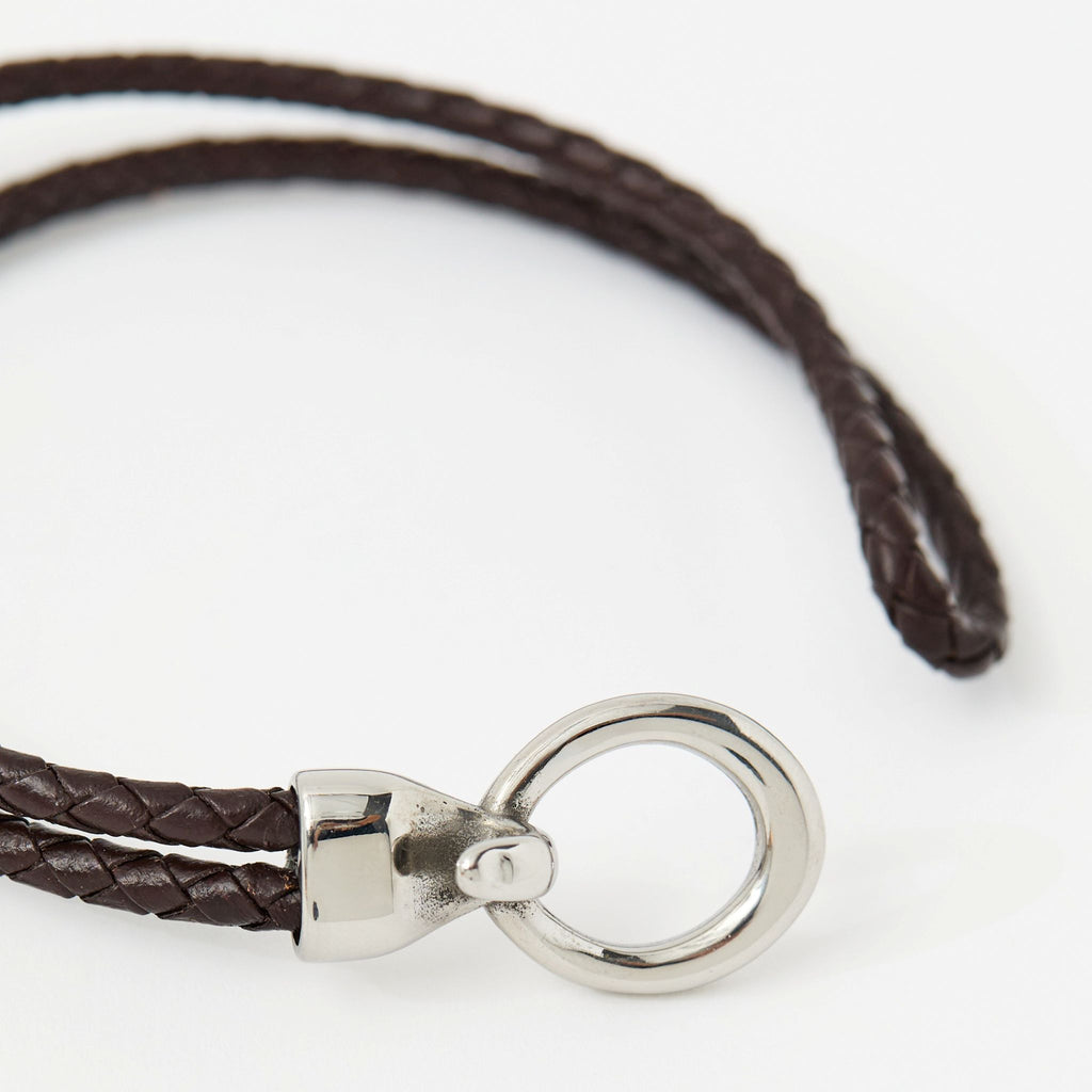 Close-up of the Merle bracelet in Chestnut Brown showing the braided leather and silver clasp