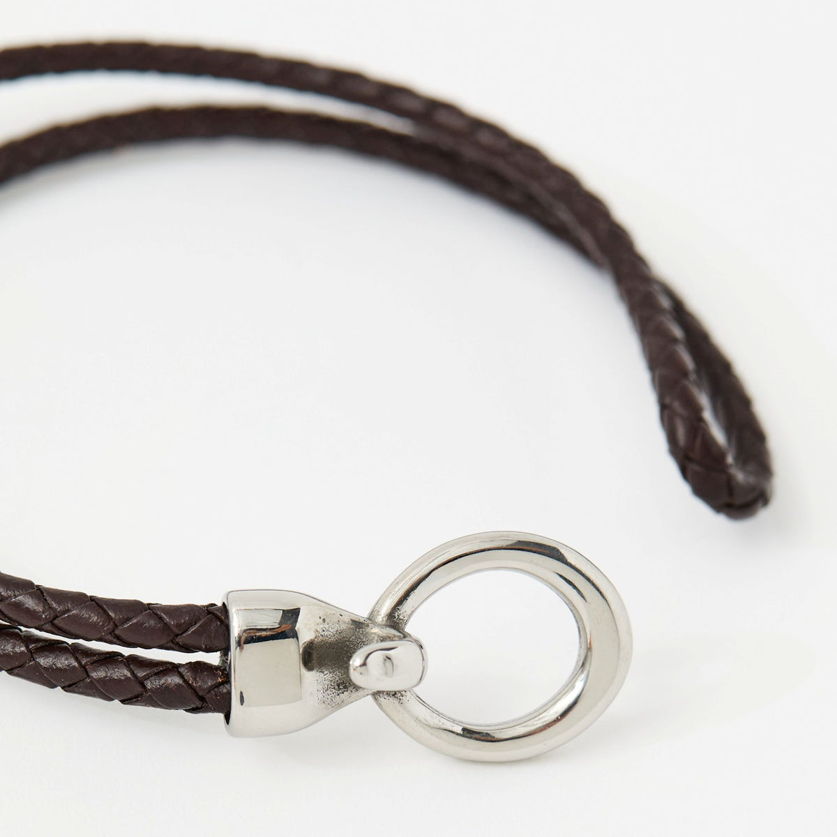 Close-up of the Merle bracelet in Chestnut Brown showing the braided leather and silver clasp