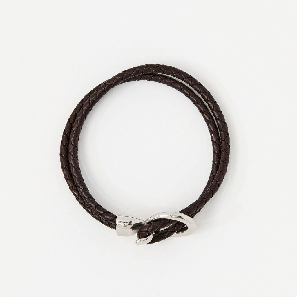 The Merle double-wrap braided leather bracelet in Chestnut Brown, flat lay