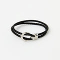 The Merle double-wrap braided leather bracelet in Midnight Black, flat lay