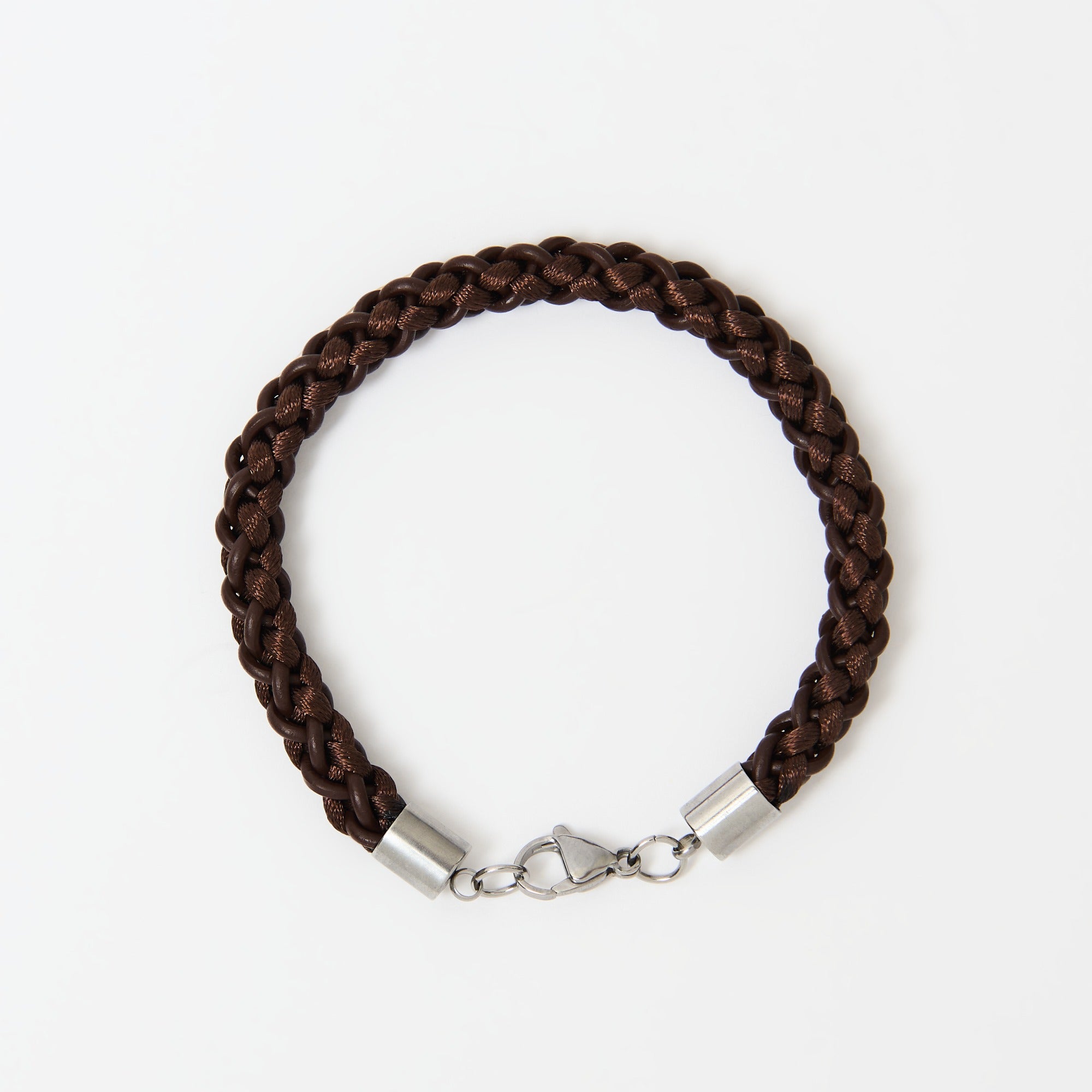 Brown braided bracelet with stainless steel clasp on a white background
