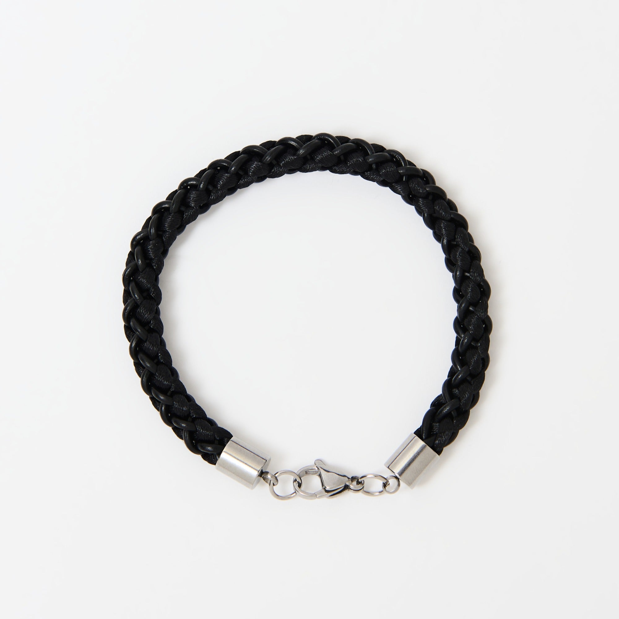 Black braided bracelet with stainless steel clasp on a white background