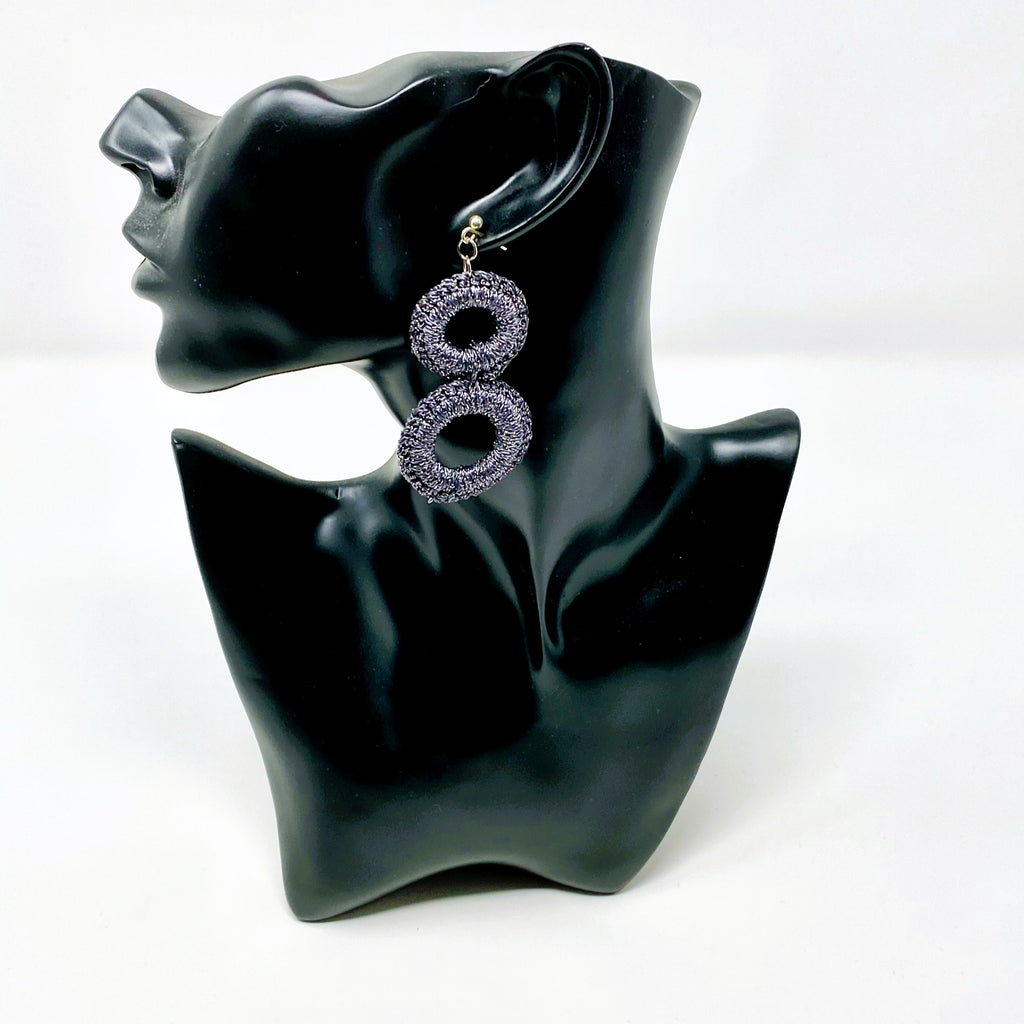 The Sienna charcoal grey crochet double-ring earring shown on a black display bust - Lodorfo