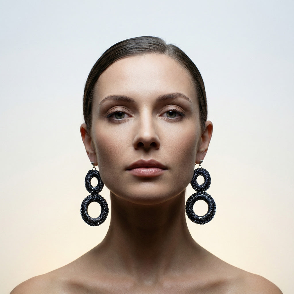 Woman with her hair back wearing the Sienna charcoal grey crochet double-ring drop earrings - Lodorfo