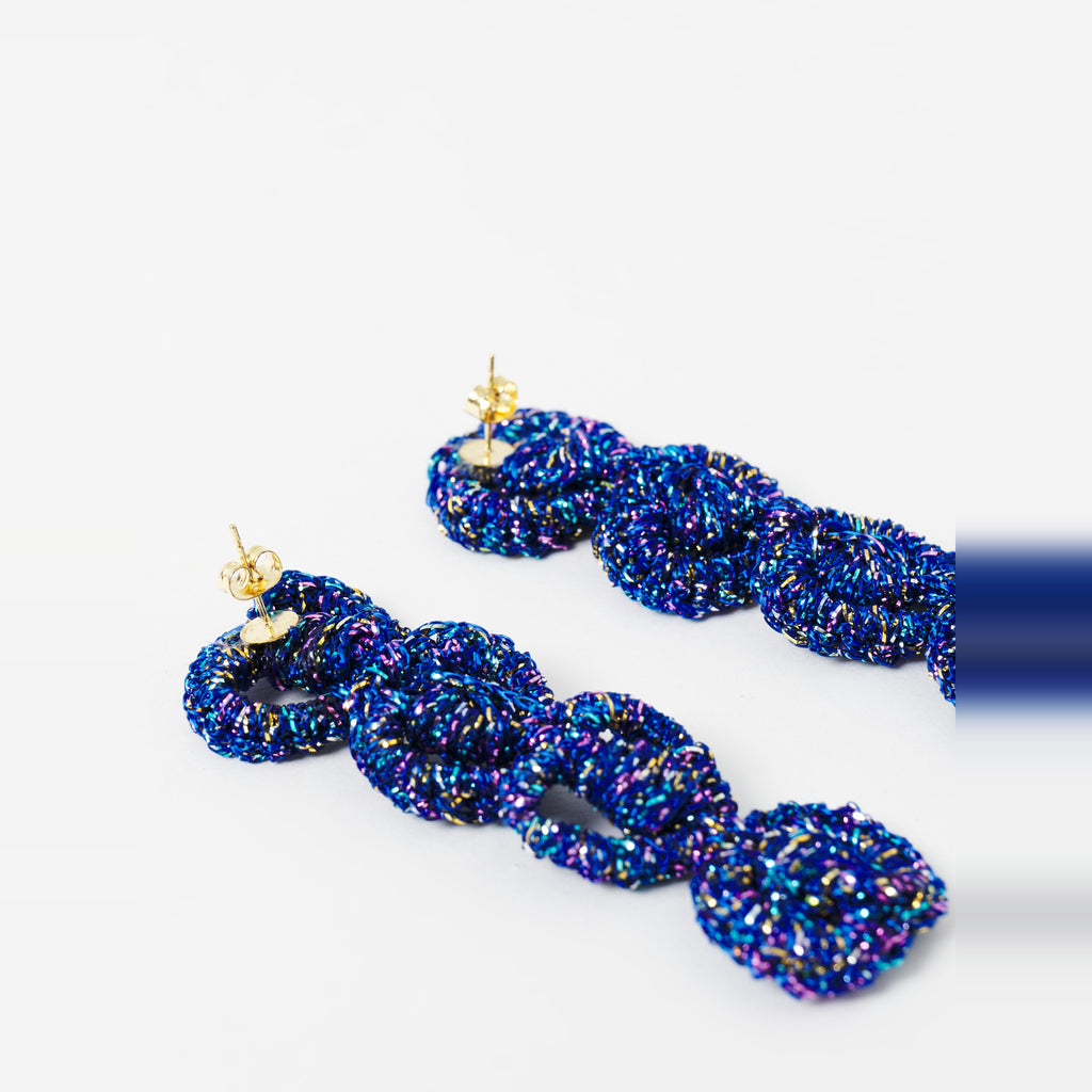 Close-up of the Arlo long indigo blue four-ring crochet loop earrings, showing the stud posts - Lodorfo