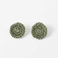 The Vela crochet disc earrings in forest green with gold shimmer, flat lay - Lodorfo