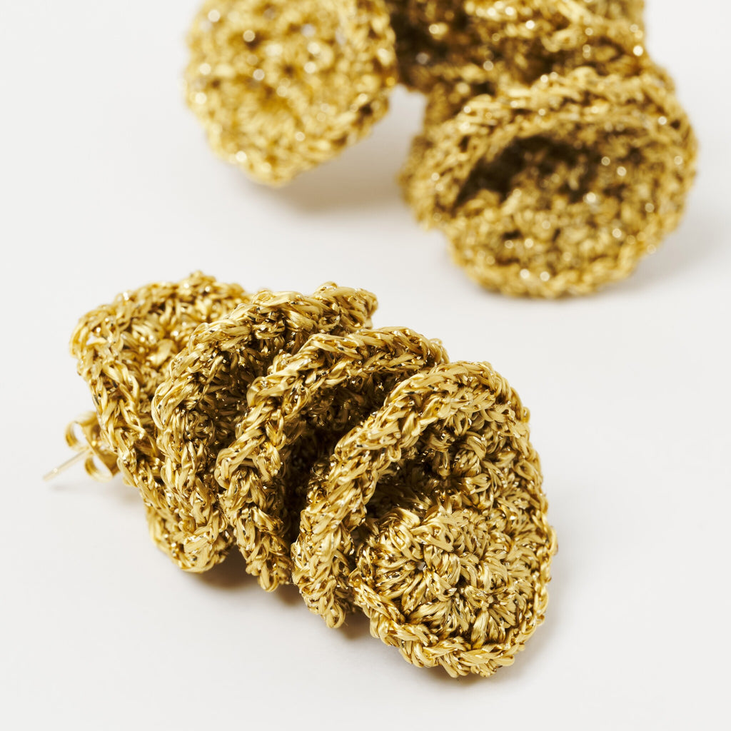 The Elara spiral drop earrings in Antique Gold Shimmer, close up - Lodorfo