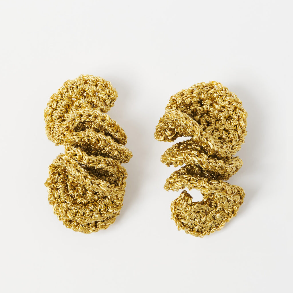 The Elara spiral drop earrings in Antique Gold Shimmer, flat lay - Lodorfo