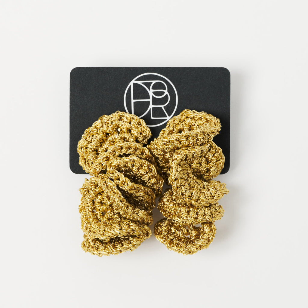 The Elara spiral drop earrings in Antique Gold Shimmer, on Lodorfo presentation card - Lodorfo