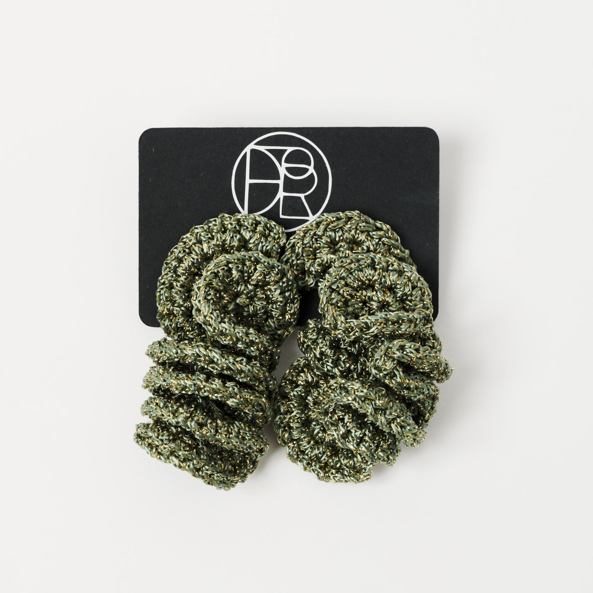 The Elara spiral drop earrings in Forest Green with gold shimmer, on Lodorfo presentation card - Lodorfo