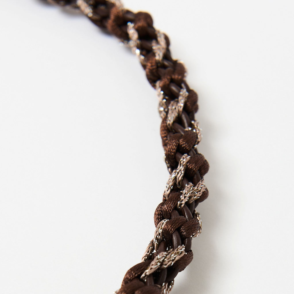 Close-up of the Kaelis chestnut brown wave braid with a silver metallic thread - Lodorfo