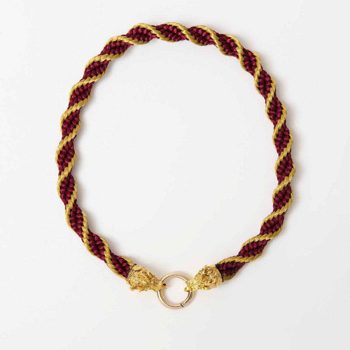 The Drakon crimson red satin-braided necklace with gold twist and dragon head clasp, laid flat - Lodorfo