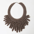 The Thorne taupe bronze crochet collar necklace with sparkle spiral fringe, laid flat - Lodorfo