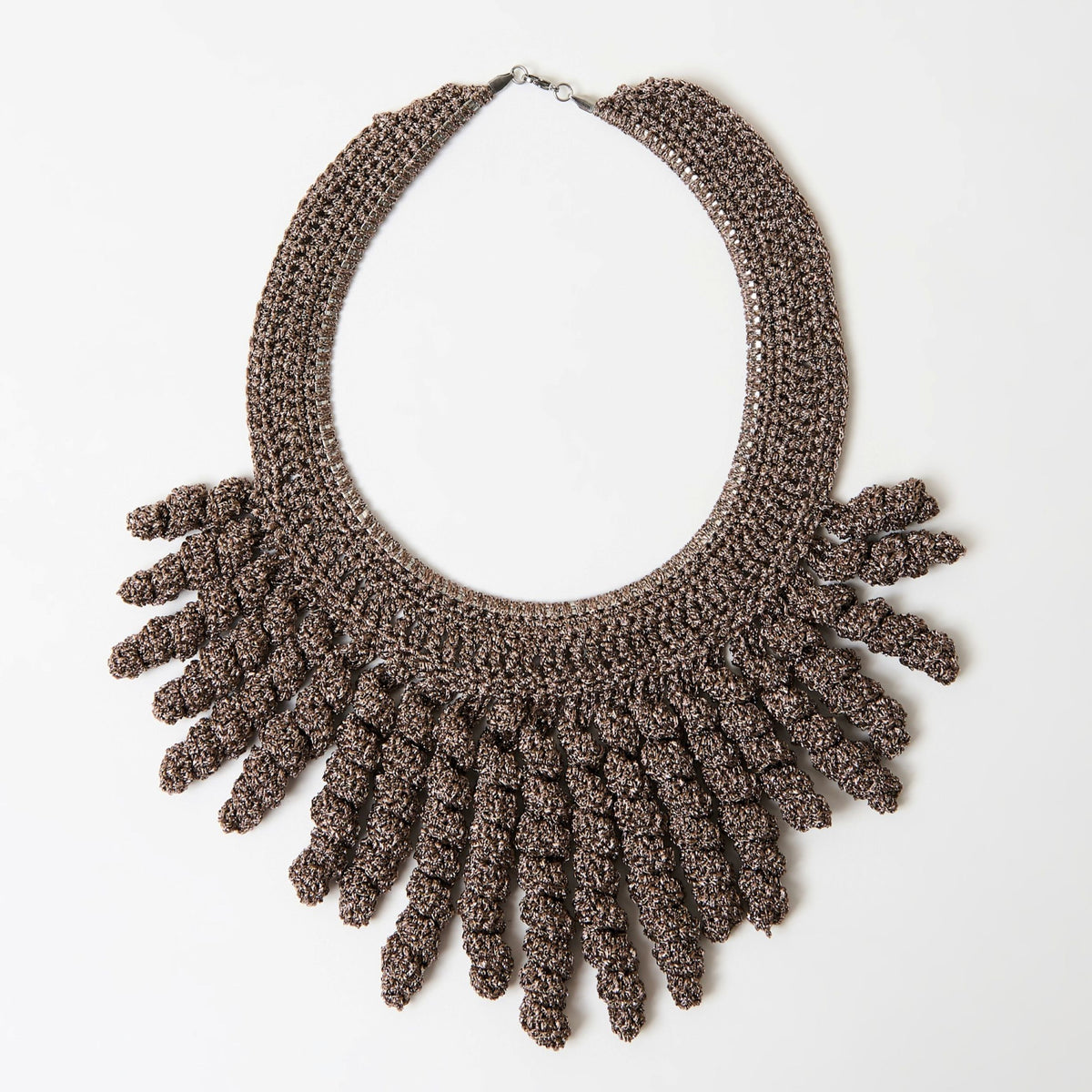 The Thorne taupe bronze crochet collar necklace with sparkle spiral fringe, laid flat - Lodorfo