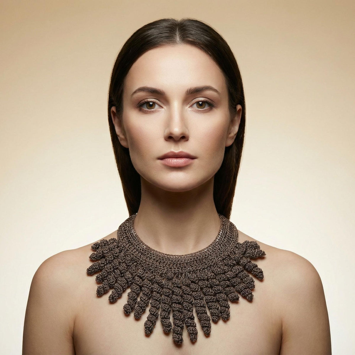 Woman with her hair back wearing the Thorne taupe bronze crochet collar necklace with spiral fringe - Lodorfo