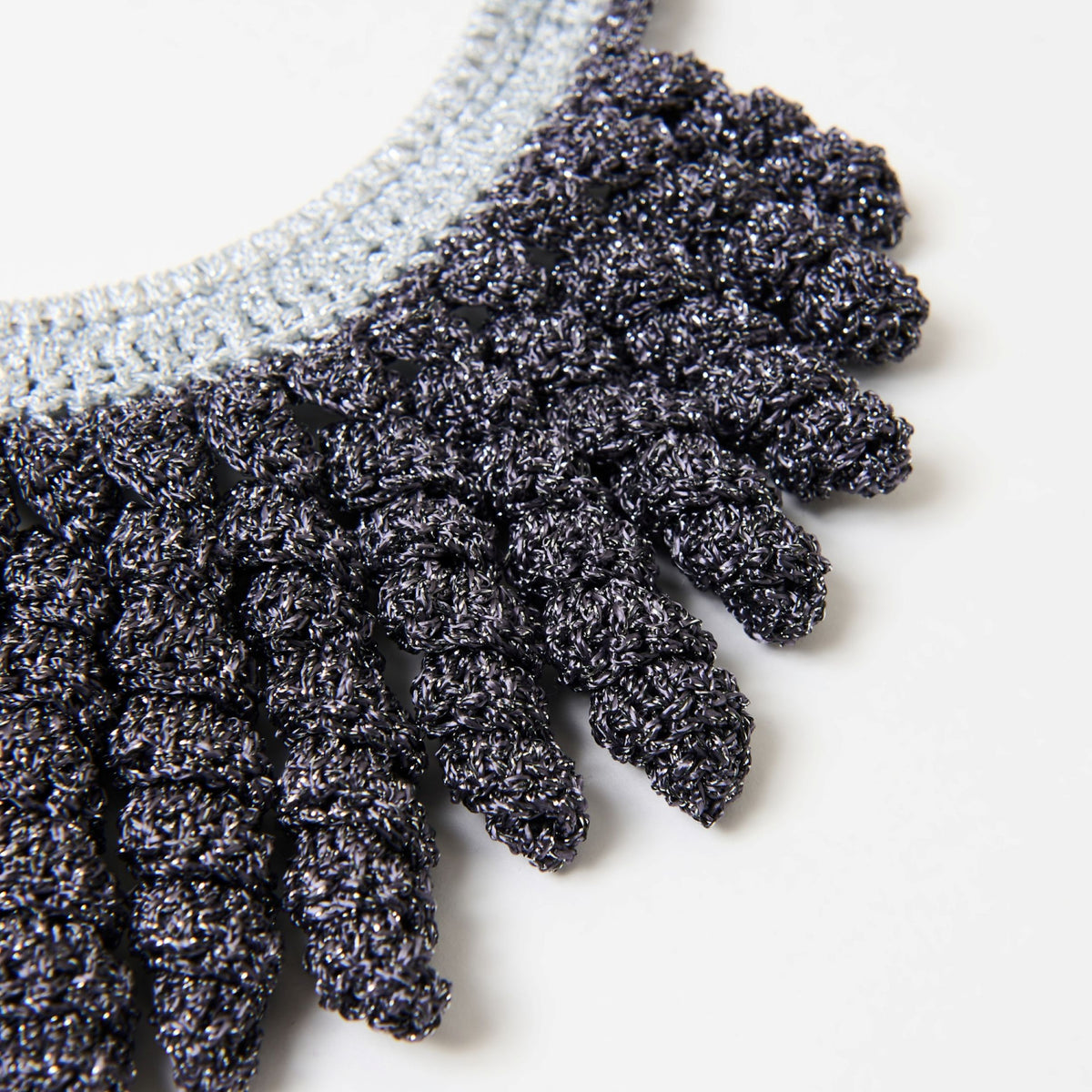 Close-up of the Vetra spiral fringe in graphite grey with silver sparkle thread - Lodorfo