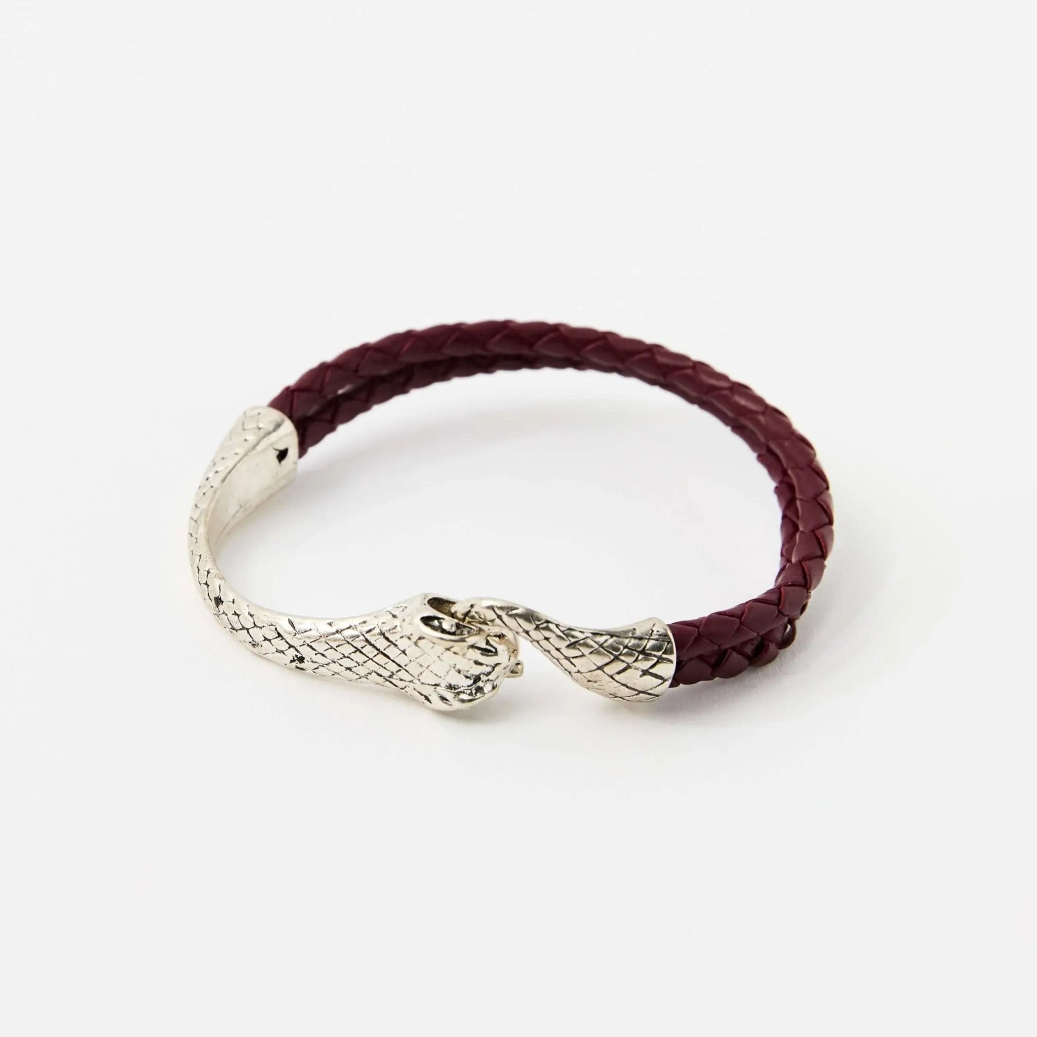 Red braided leather bracelet with a silver snake head clasp, featuring intricate scale details and a sleek, minimalistic design.