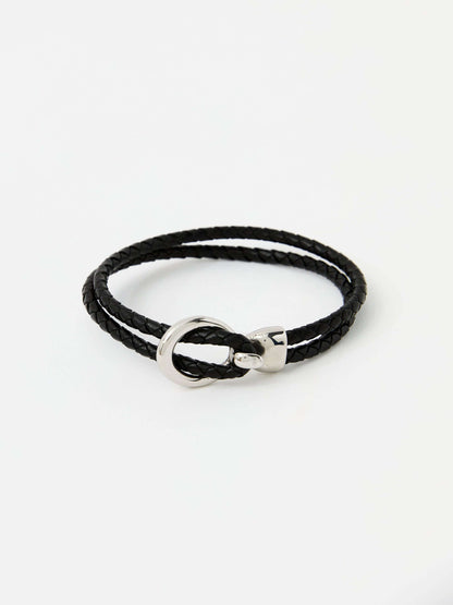 Black braided leather bracelet with a sleek silver loop and knot clasp, showcasing a modern and minimalist style.