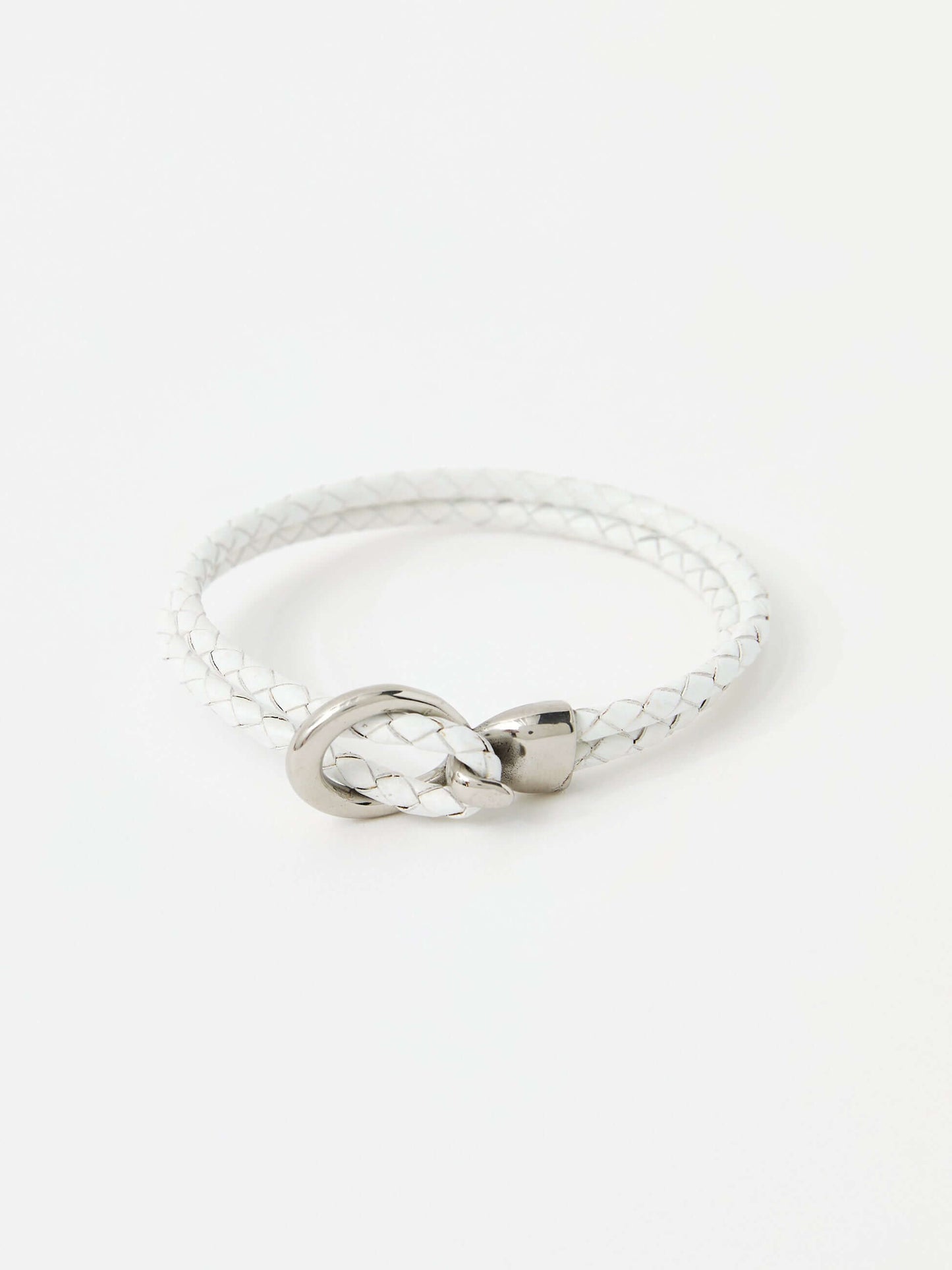 White braided leather bracelet with a sleek silver loop and knot clasp, showcasing a modern and minimalist style.