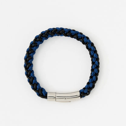 Braided blue and black bracelet with a silver clasp on a white background