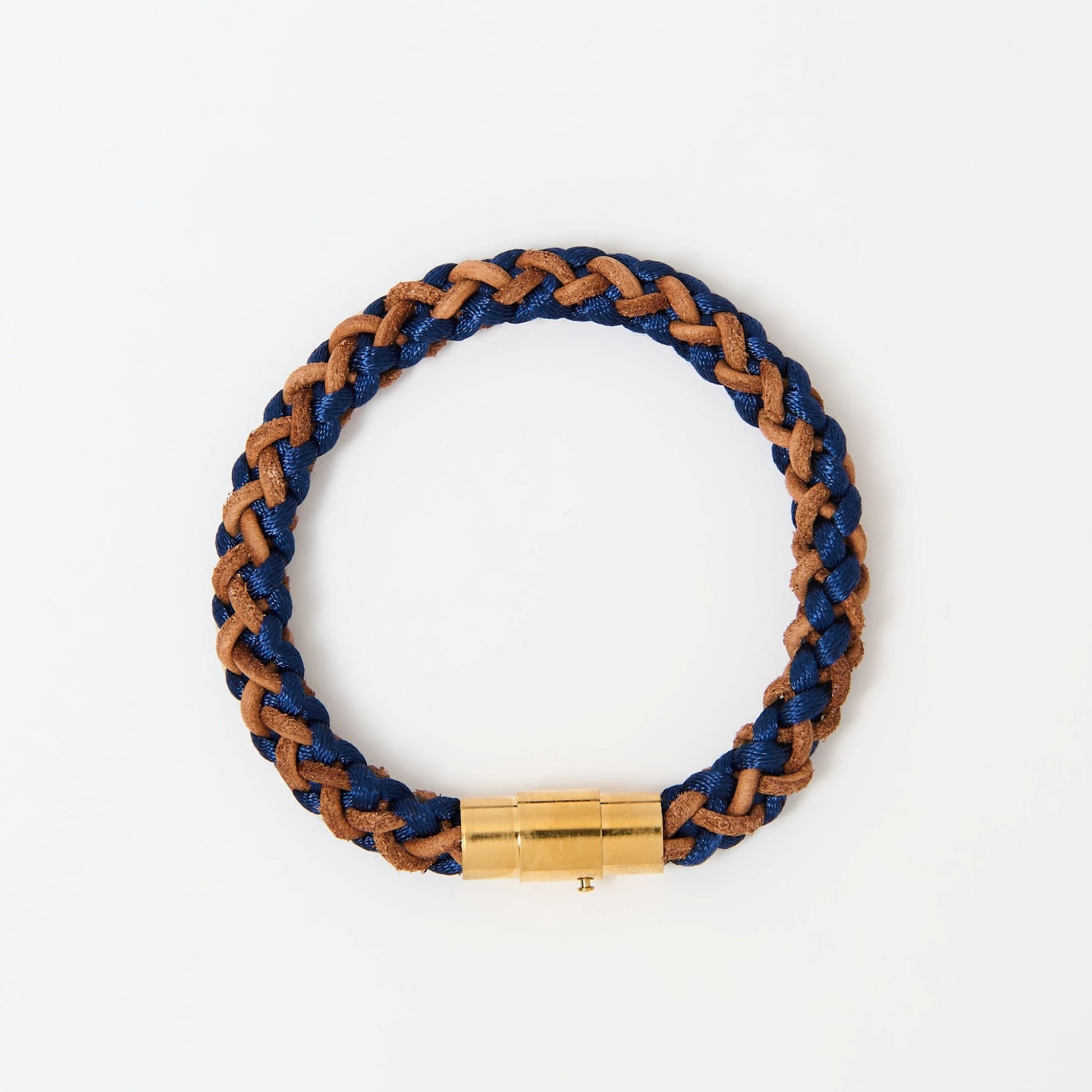 Artisan-crafted men’s bracelet with navy blue and brown braided leather and polished gold magnetic clasp — modern accessory with timeless appeal.