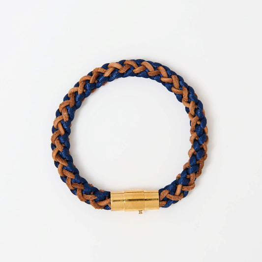 Artisan-crafted men’s bracelet with navy blue and brown braided leather and polished gold magnetic clasp — modern accessory with timeless appeal.