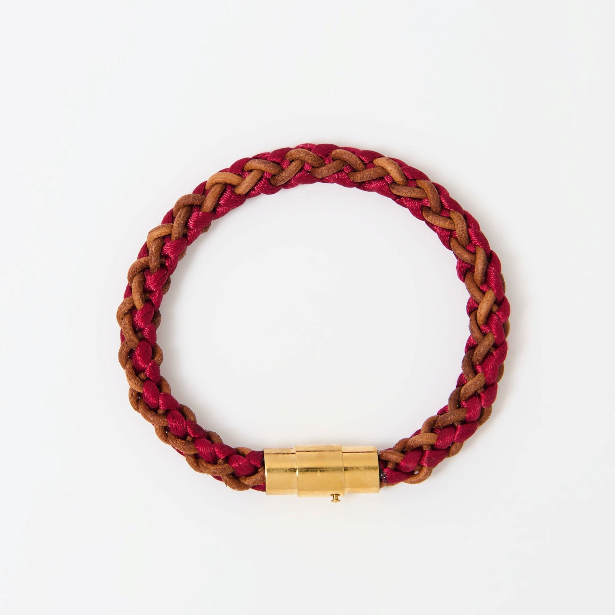 Artisan-crafted men’s bracelet with red and brown braided leather and polished gold magnetic clasp — modern accessory with timeless appeal.