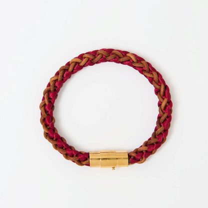 Artisan-crafted men’s bracelet with red and brown braided leather and polished gold magnetic clasp — modern accessory with timeless appeal.