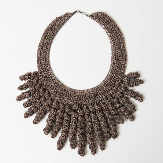 Handmade frill statement necklace in copper with silver shine featuring a bold textured fan-like fringe design, laid flat on a white background.