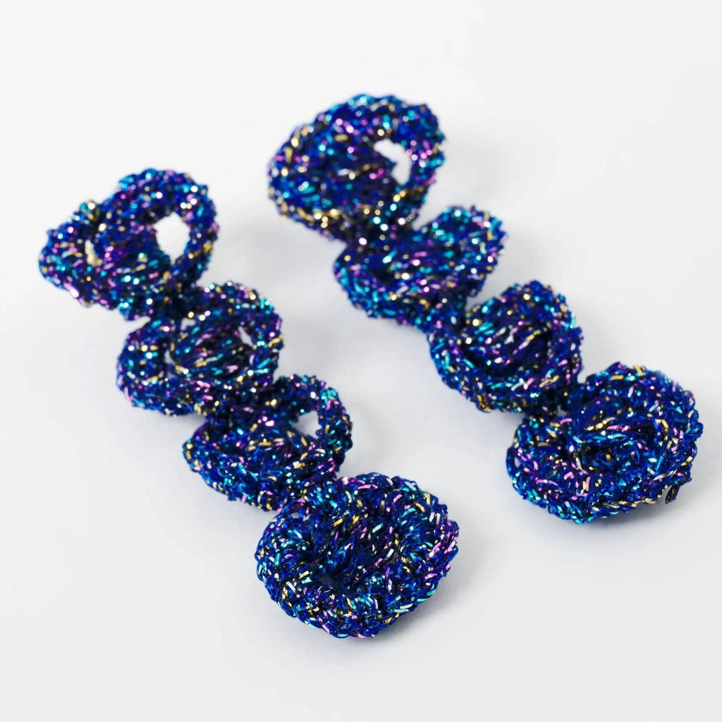 The Arlo sculptural loop earrings, product flat lay — Lodorfo