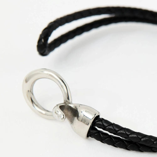 The Merle double-wrap braided leather bracelet in Midnight Black with a silver ring clasp, product shot